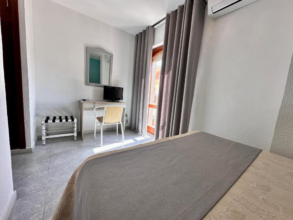 Postel nebo postele na pokoji v ubytování Hotel El Paraíso