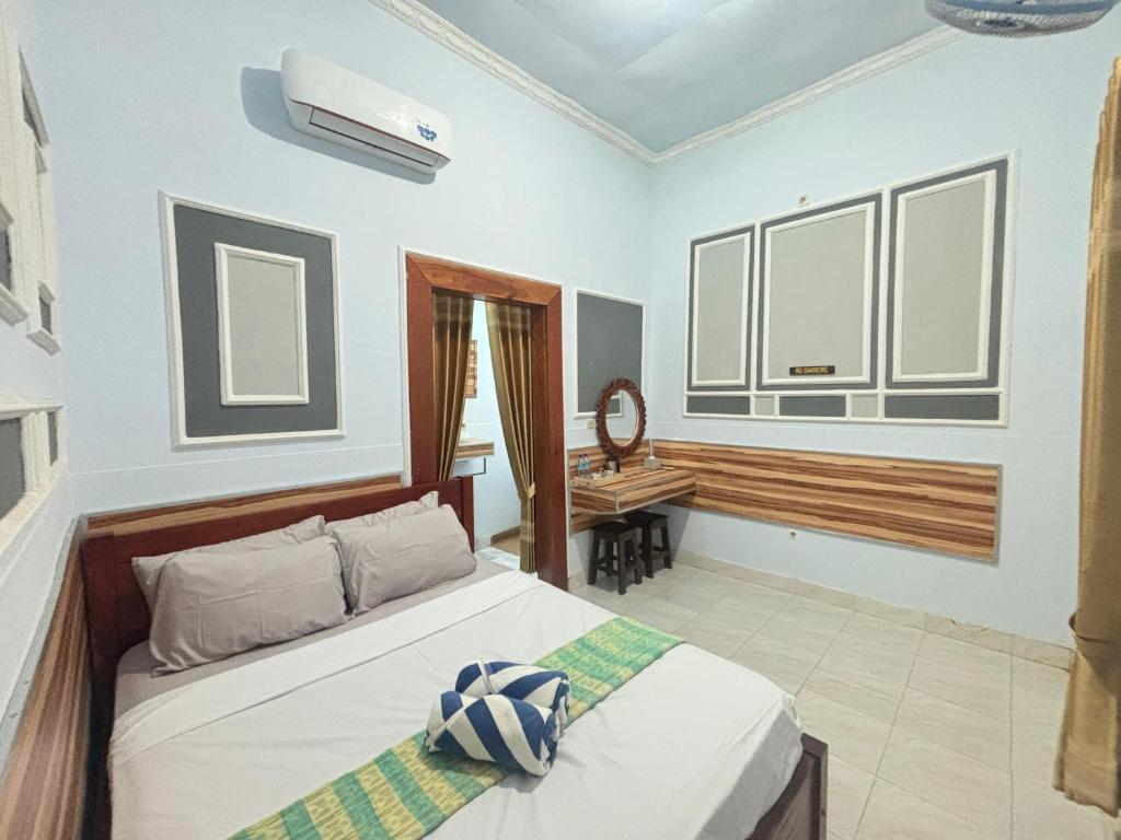 Ένα ή περισσότερα κρεβάτια σε δωμάτιο στο Banera Gili Homestay
