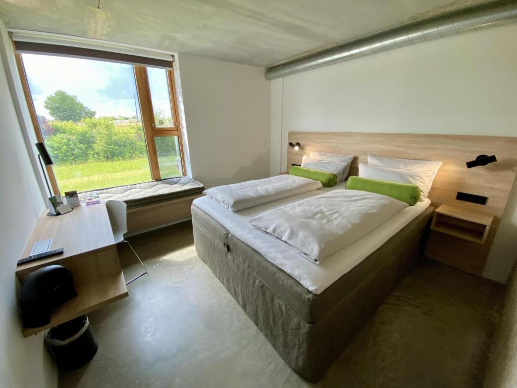 Postel nebo postele na pokoji v ubytování Avaneo Hotel Marktredwitz