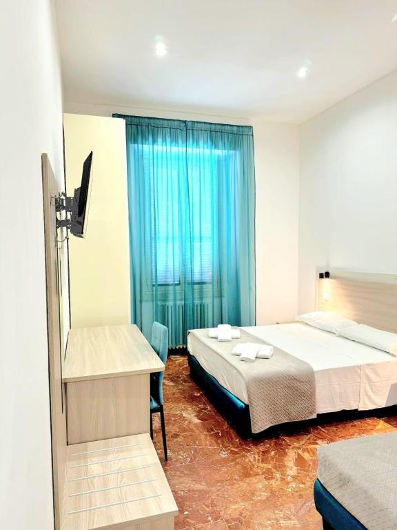 Łóżko lub łóżka w pokoju w obiekcie Tawhid Accomodation