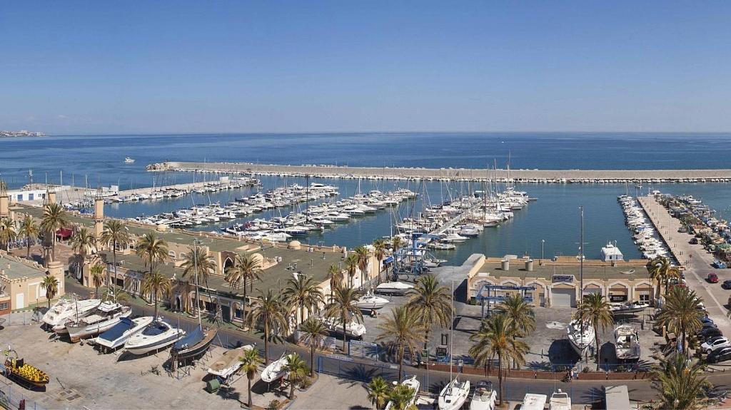 an aerial view of a marina with boats in the water at Apartamento junto a puerto Fuengirola in Fuengirola