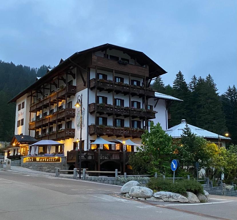 a large building on the side of a street at Hotel Bertelli in Madonna di Campiglio