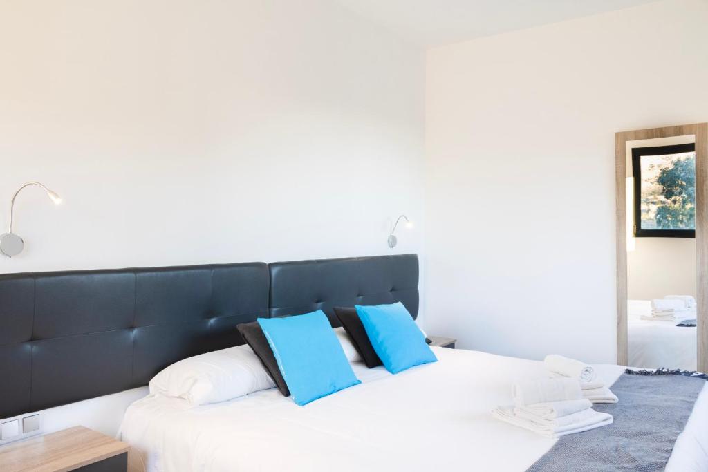 Postel nebo postele na pokoji v ubytování Hotel Portmán