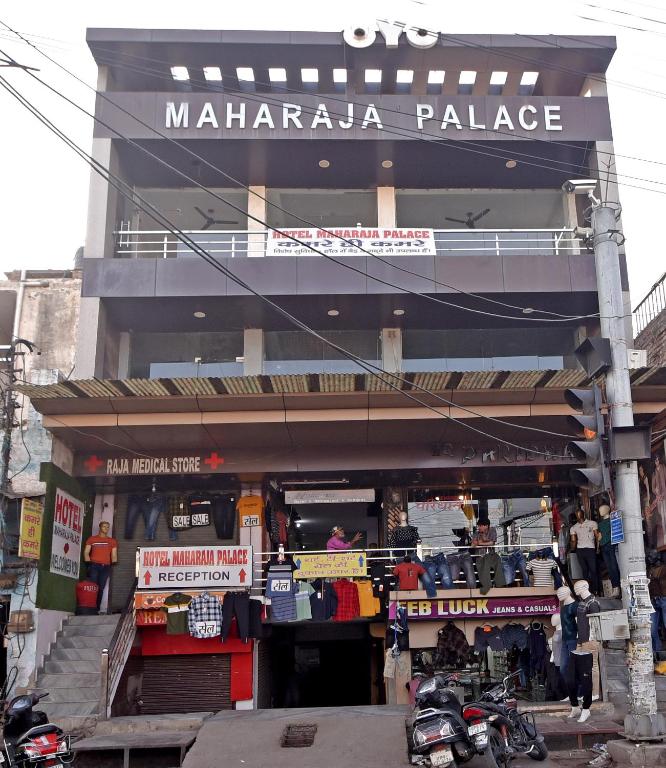 a mallaza palace with motorcycles parked in front of it at Hotel Maharaja Palace in Alīgarh