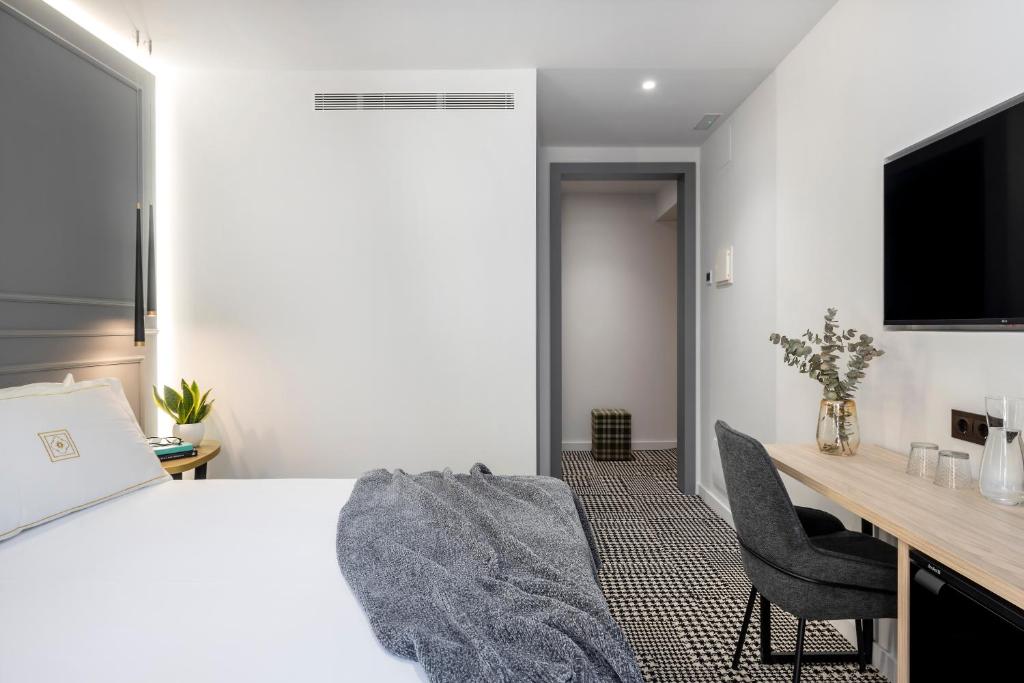 TV a/nebo společenská místnost v ubytování Cal Roure Boutique Hotel