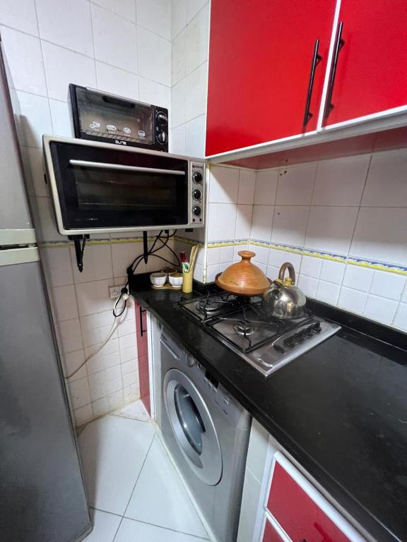 Kuchyň nebo kuchyňský kout v ubytování Appartement luxueux