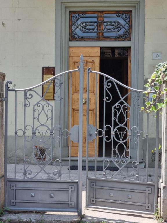 an iron gate in front of a door at viola in Sansepolcro