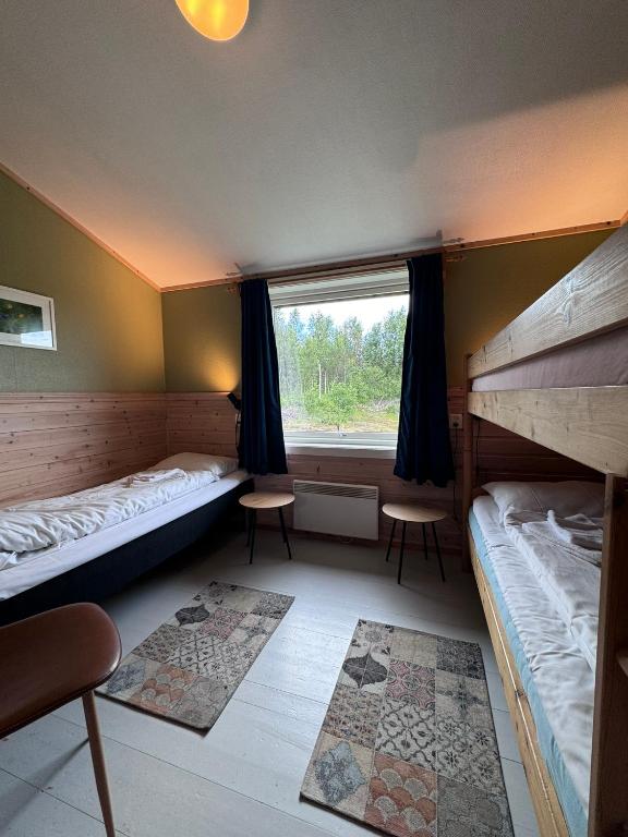Postel nebo postele na pokoji v ubytování Skoghus
