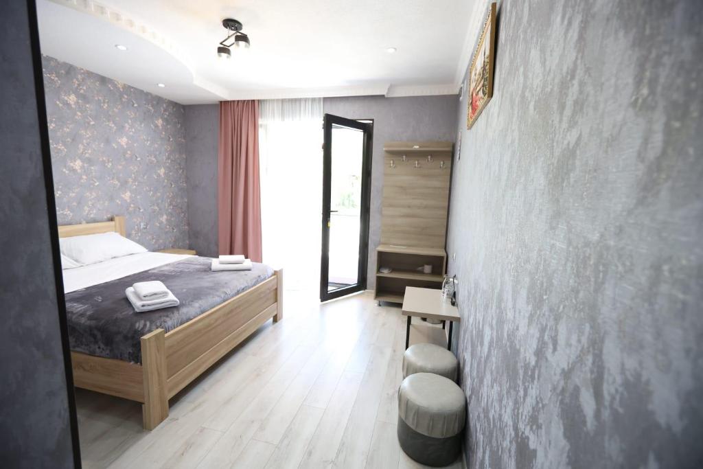 Postel nebo postele na pokoji v ubytování Hotel Tsiskari