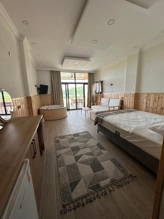 Postel nebo postele na pokoji v ubytování Aurora Suit Bungalov