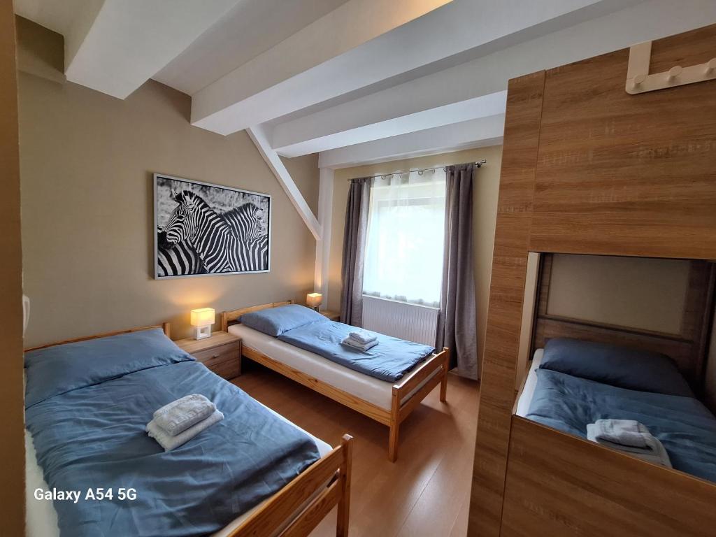 Postel nebo postele na pokoji v ubytování AlpenKlub Hotel