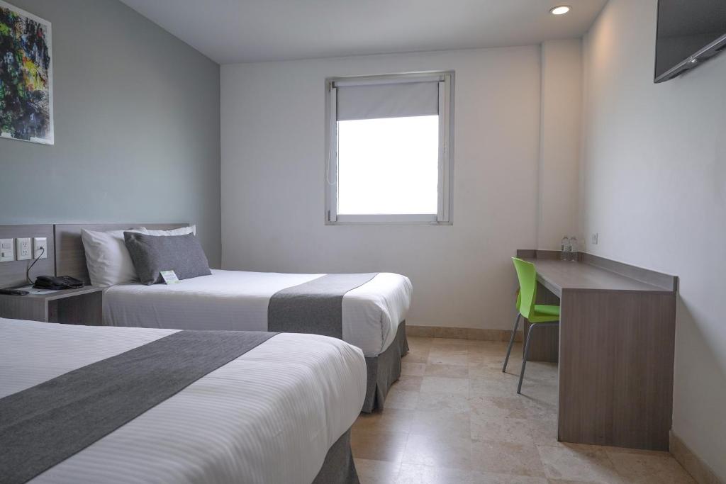 Postel nebo postele na pokoji v ubytování SR Hotel