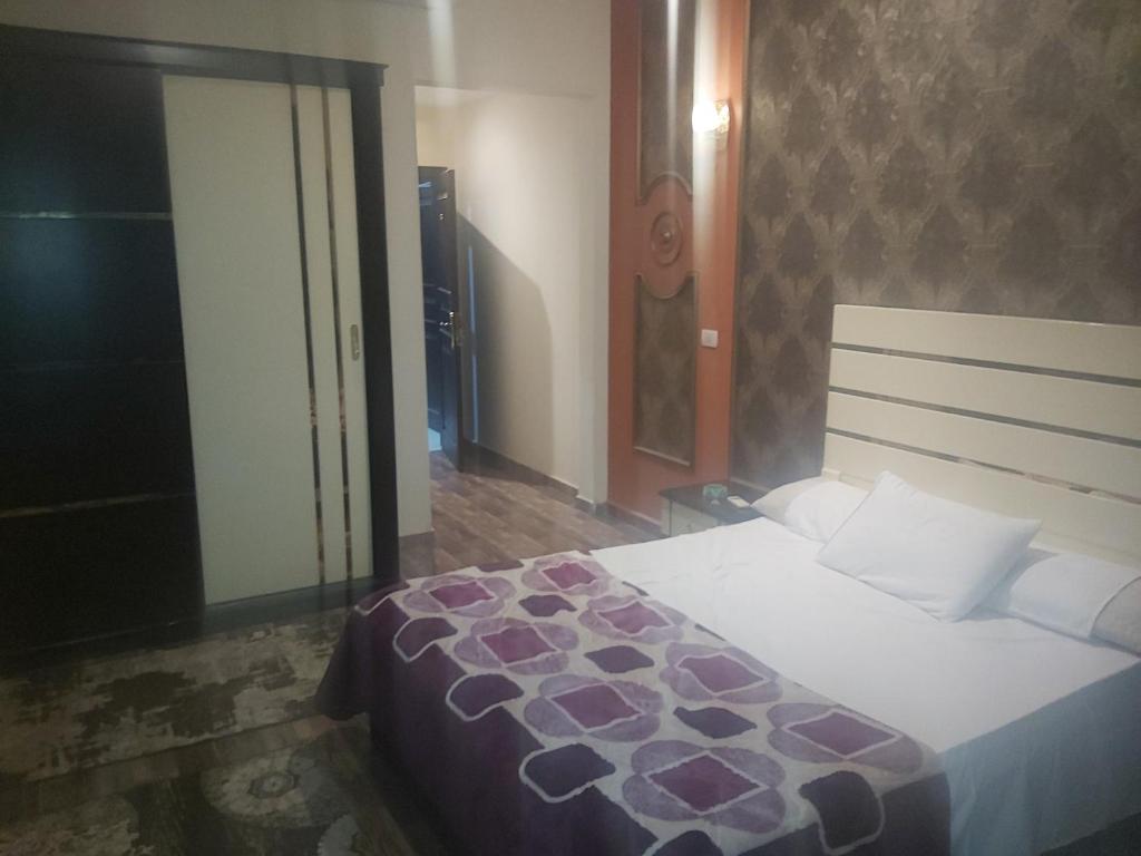 Postel nebo postele na pokoji v ubytování فيلا اللؤلؤة