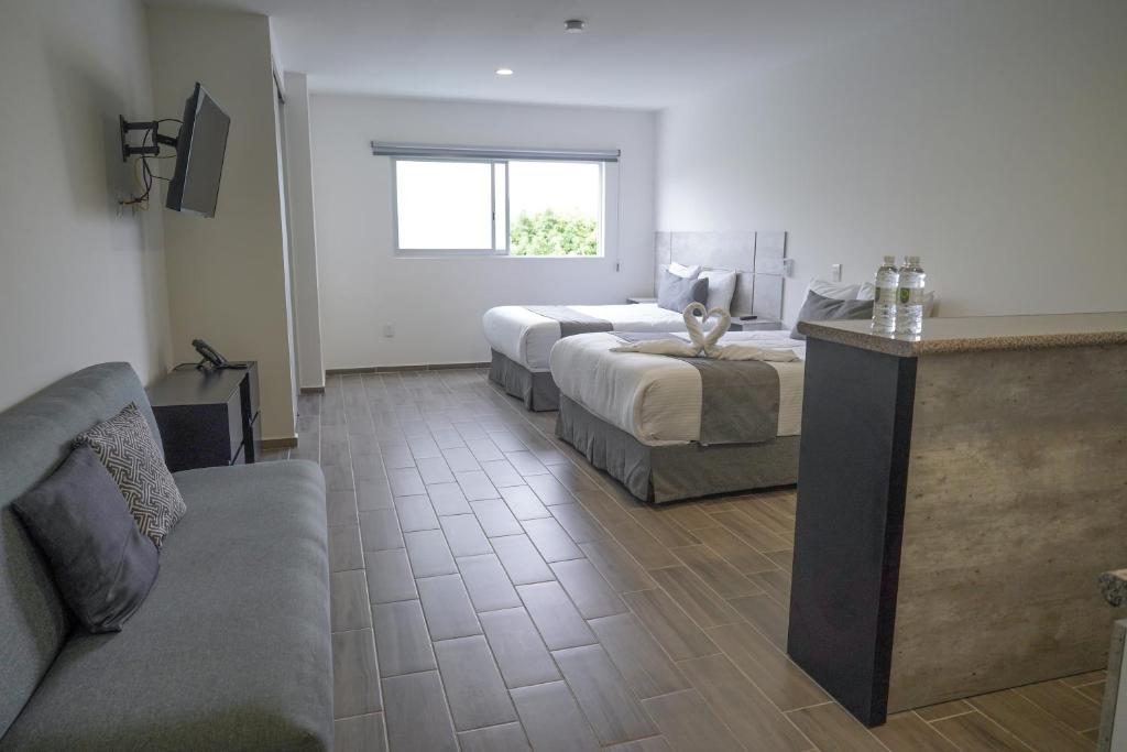 Postel nebo postele na pokoji v ubytování SR Hotel