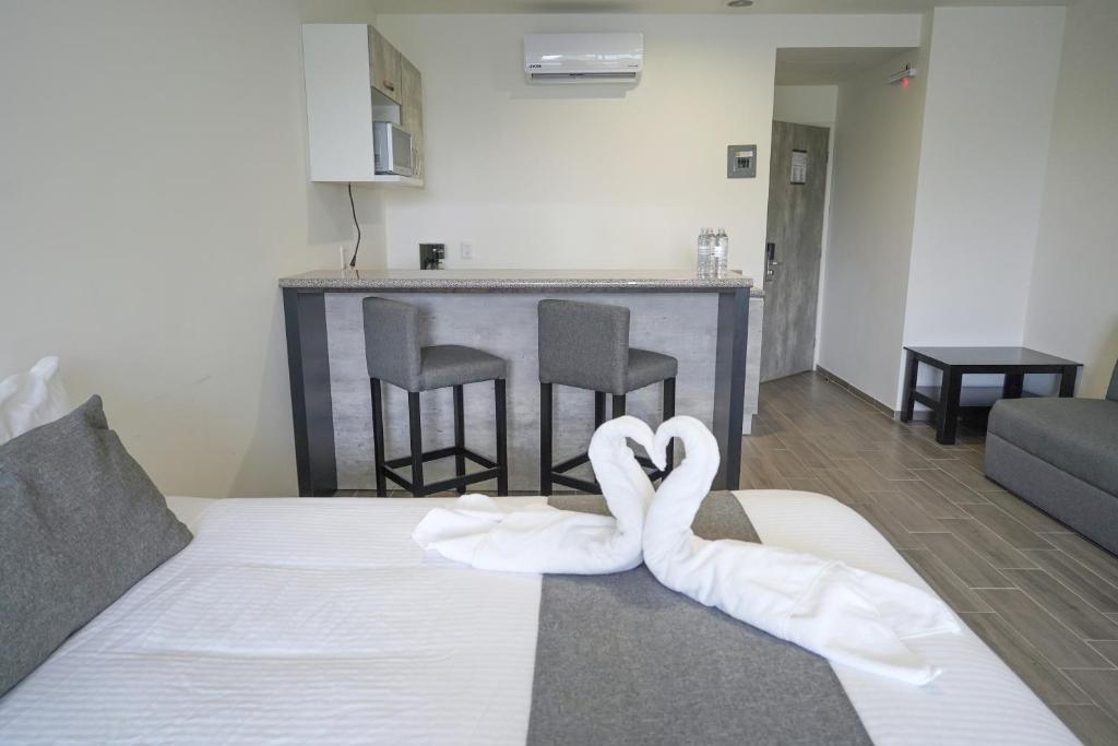 Postel nebo postele na pokoji v ubytování SR Hotel