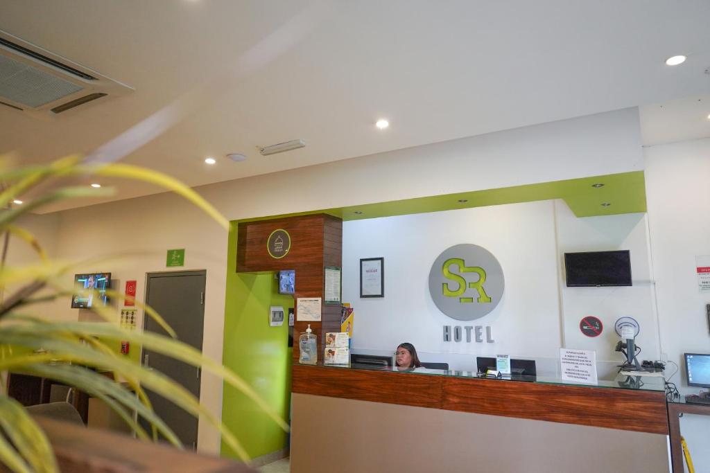 TV a/nebo společenská místnost v ubytování SR Hotel