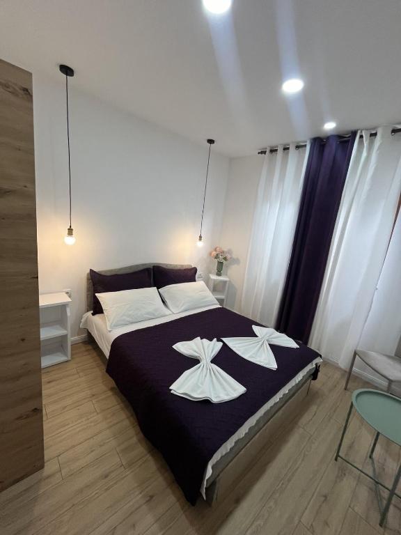 Postel nebo postele na pokoji v ubytování Studio Rooms Moncherie