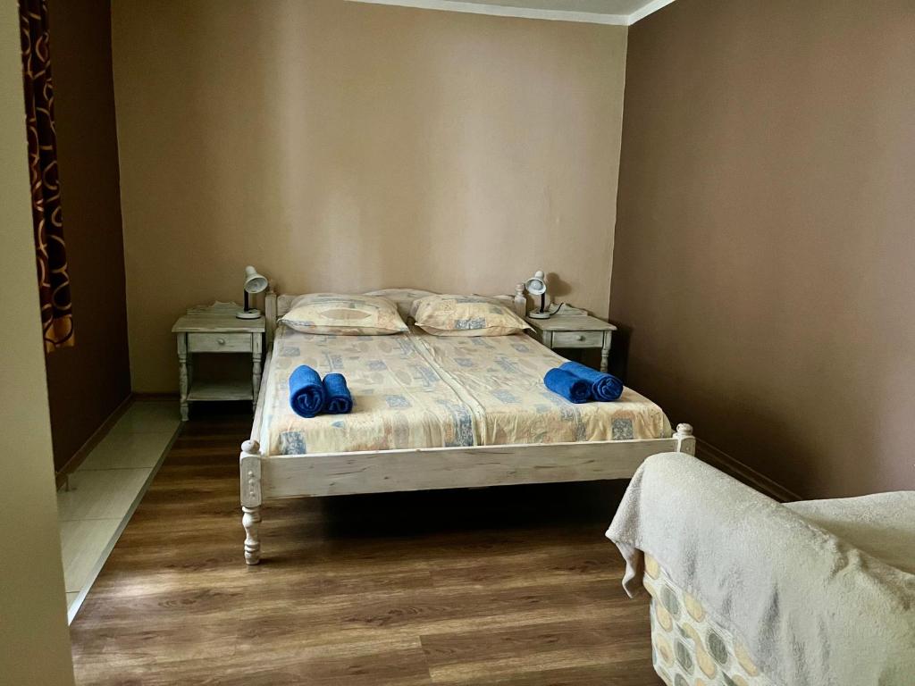 A bed or beds in a room at Paunovi Guest House