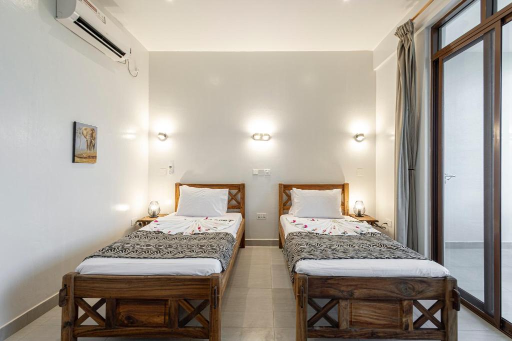 Postel nebo postele na pokoji v ubytování YU Resort