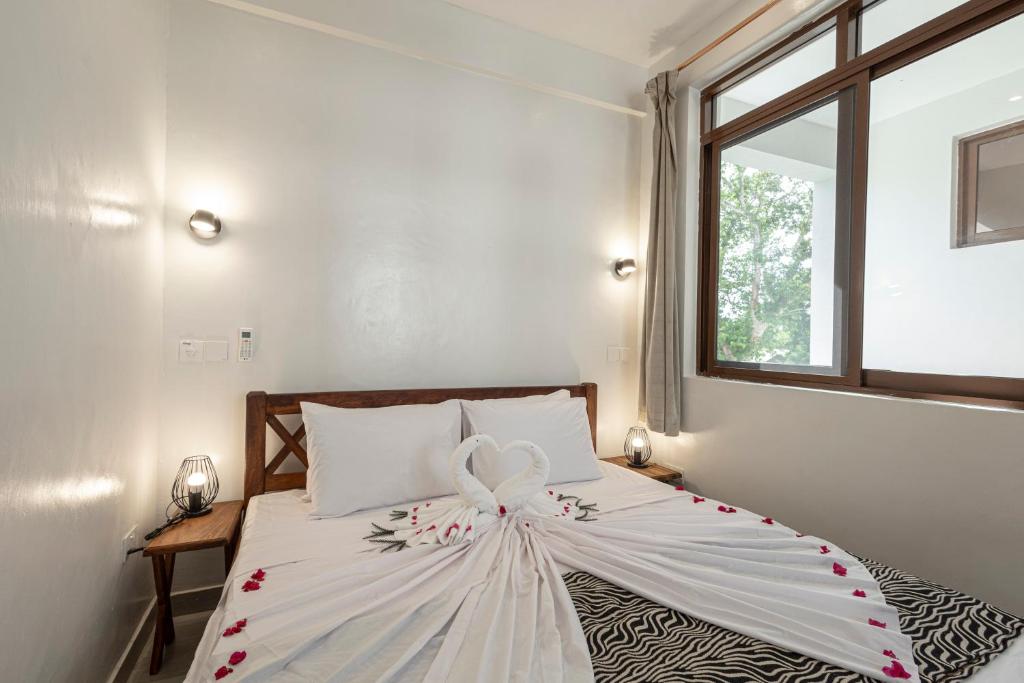 Postel nebo postele na pokoji v ubytování YU Resort