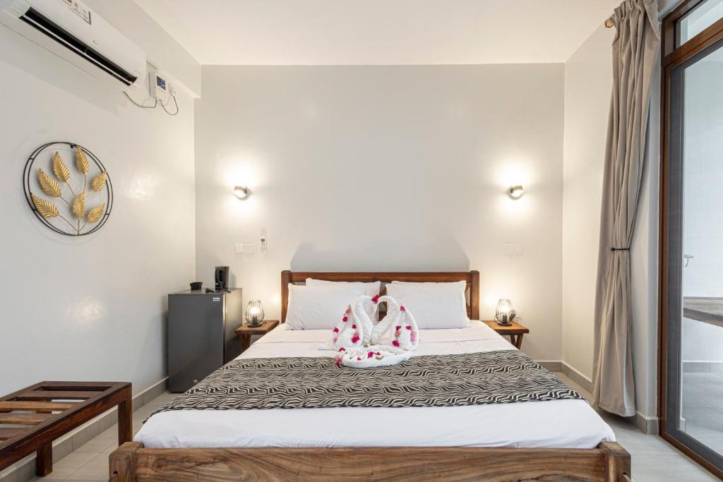 Postel nebo postele na pokoji v ubytování YU Resort