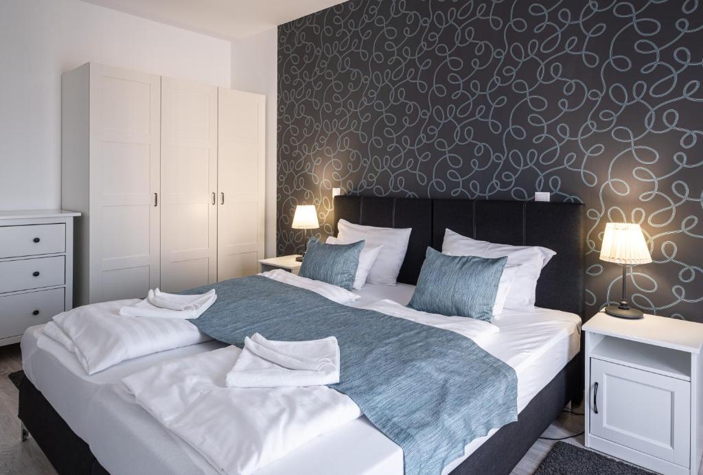 Postel nebo postele na pokoji v ubytování Aranymandula apartmanok