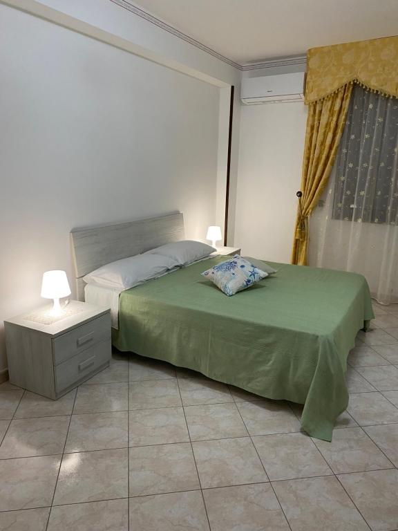 Posteľ alebo postele v izbe v ubytovaní CASA VACANZE AMBRA