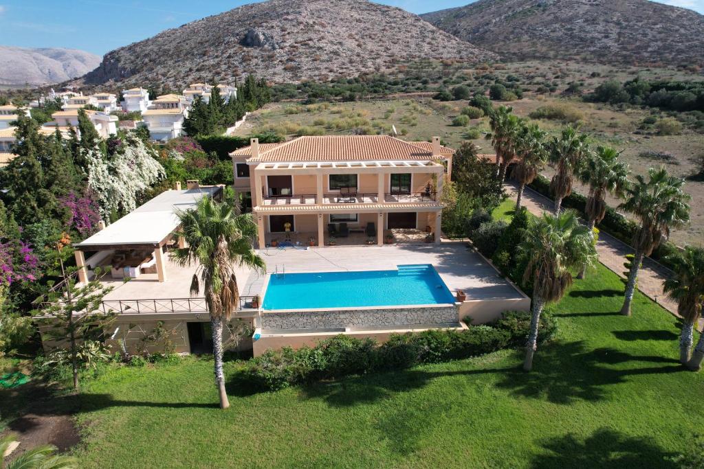 an aerial view of a house with a swimming pool at Sunset Villa in Saronida