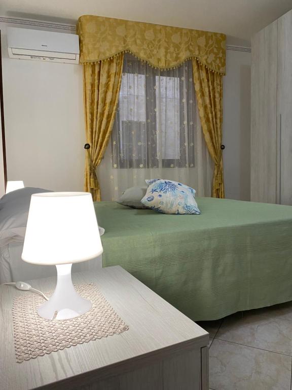 Posteľ alebo postele v izbe v ubytovaní CASA VACANZE AMBRA