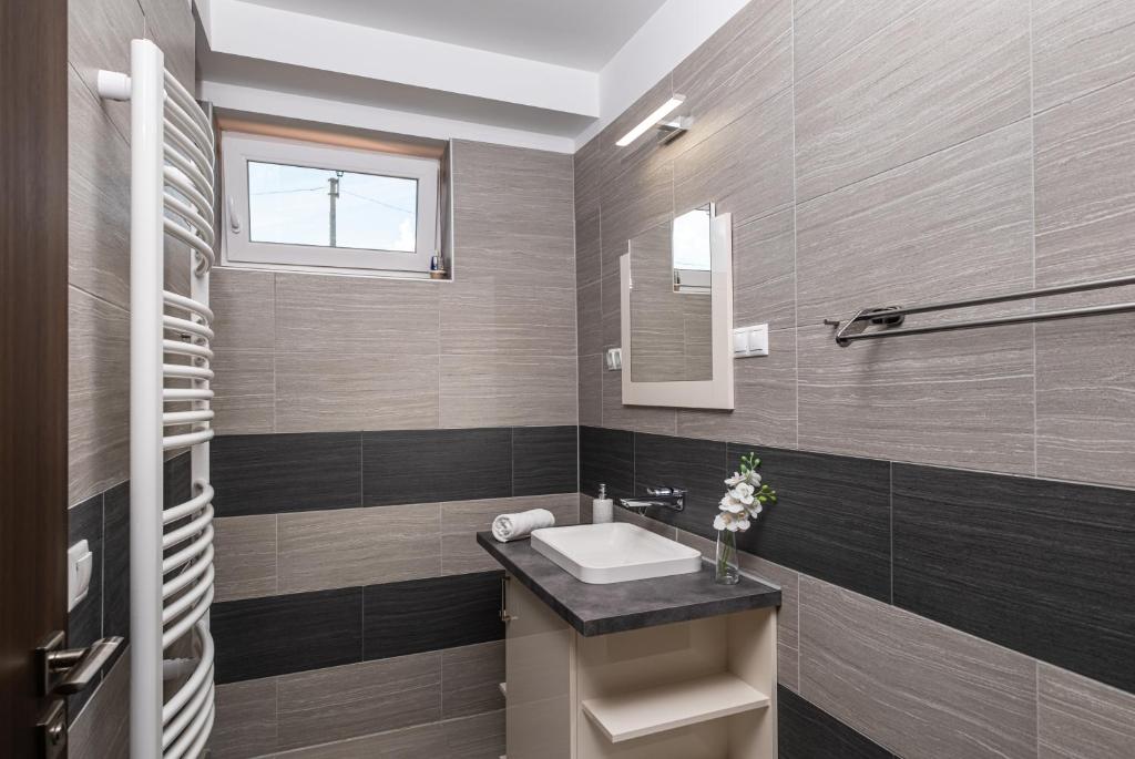 Koupelna v ubytování Aranymandula apartmanok