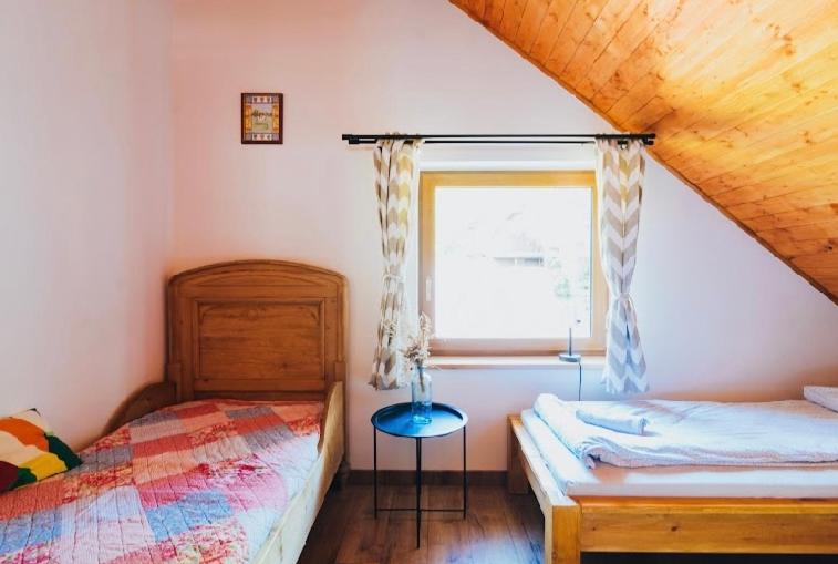 Postel nebo postele na pokoji v ubytování Apartamenty Cichy Kącik