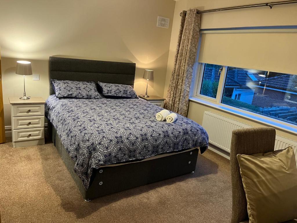 Postel nebo postele na pokoji v ubytování MapleHouse B&B