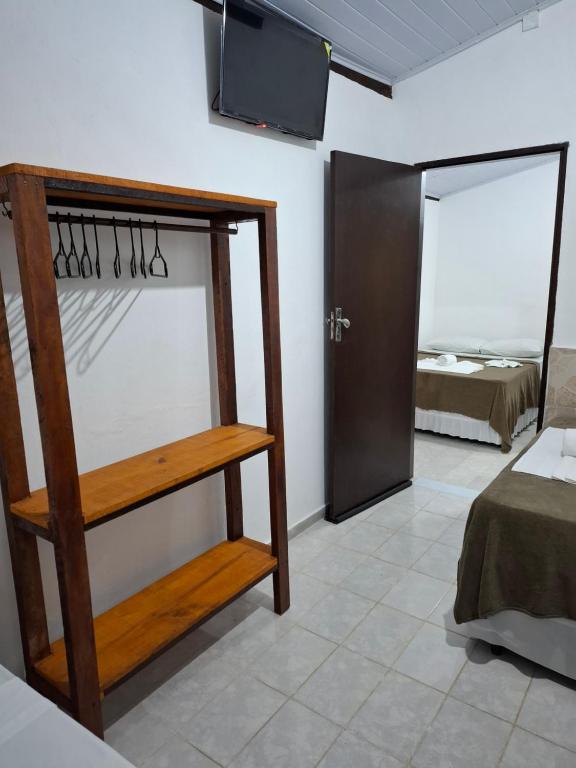 Postel nebo postele na pokoji v ubytování Pousada Biribiri Arraial D'ajuda - À 10 metros da Rua Mucugê