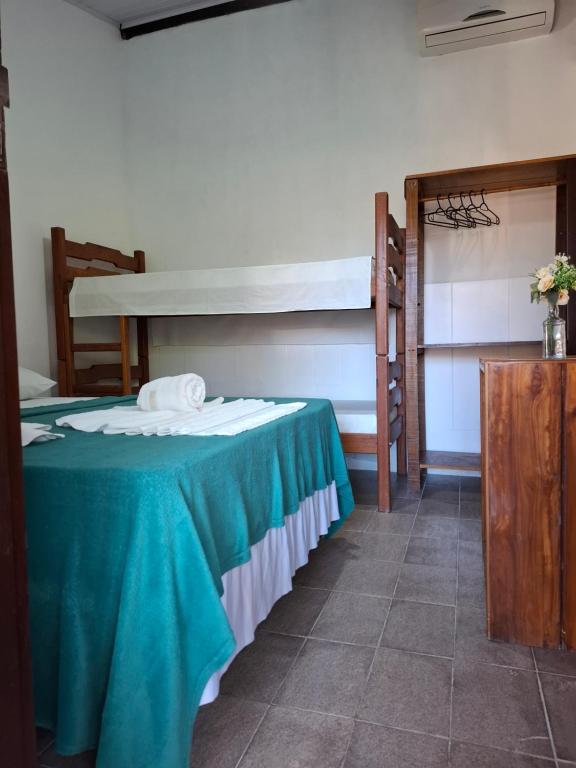 Postel nebo postele na pokoji v ubytování Pousada Biribiri Arraial D'ajuda - À 10 metros da Rua Mucugê
