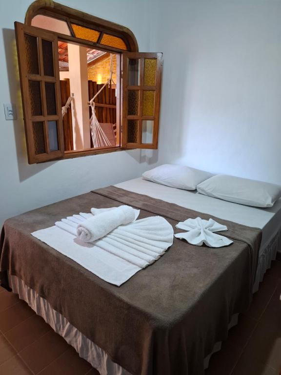 Postel nebo postele na pokoji v ubytování Pousada Biribiri Arraial D'ajuda - À 10 metros da Rua Mucugê