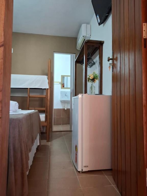 Postel nebo postele na pokoji v ubytování Pousada Biribiri Arraial D'ajuda - À 10 metros da Rua Mucugê