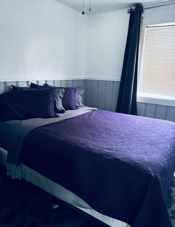 Postel nebo postele na pokoji v ubytování Sunset Motel