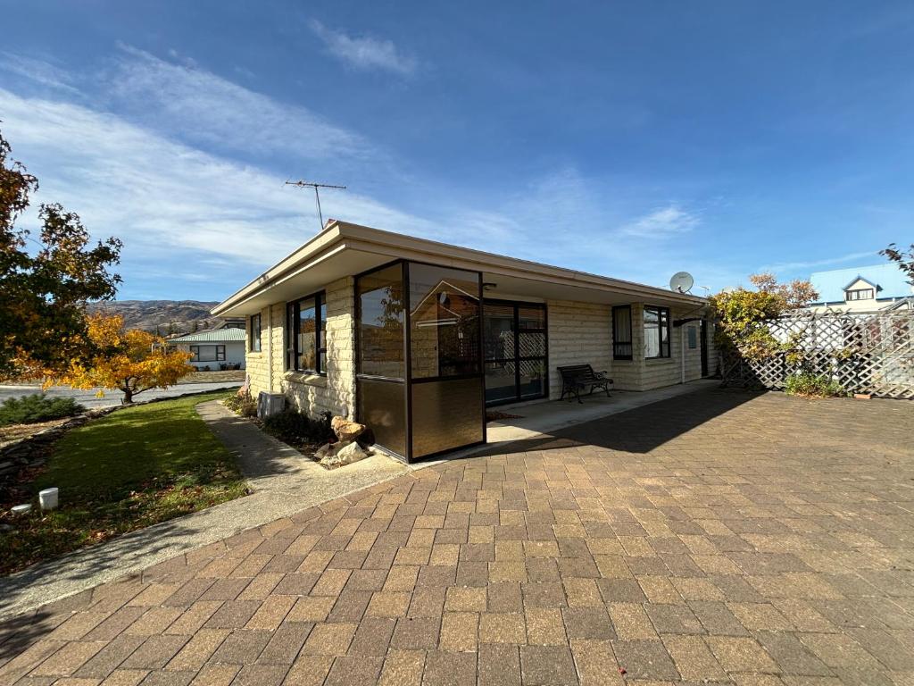 a small house with a porch and a patio at Home Away From Home in Cromwell