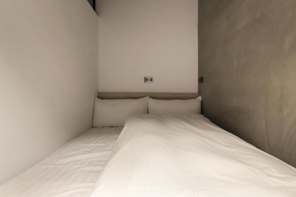 MINI HOTELS(逢甲館)客房内的一张或多张床位