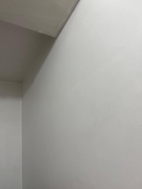 a room with a white wall and a ceiling at guest house panorama GJirokaster in Gjirokastër