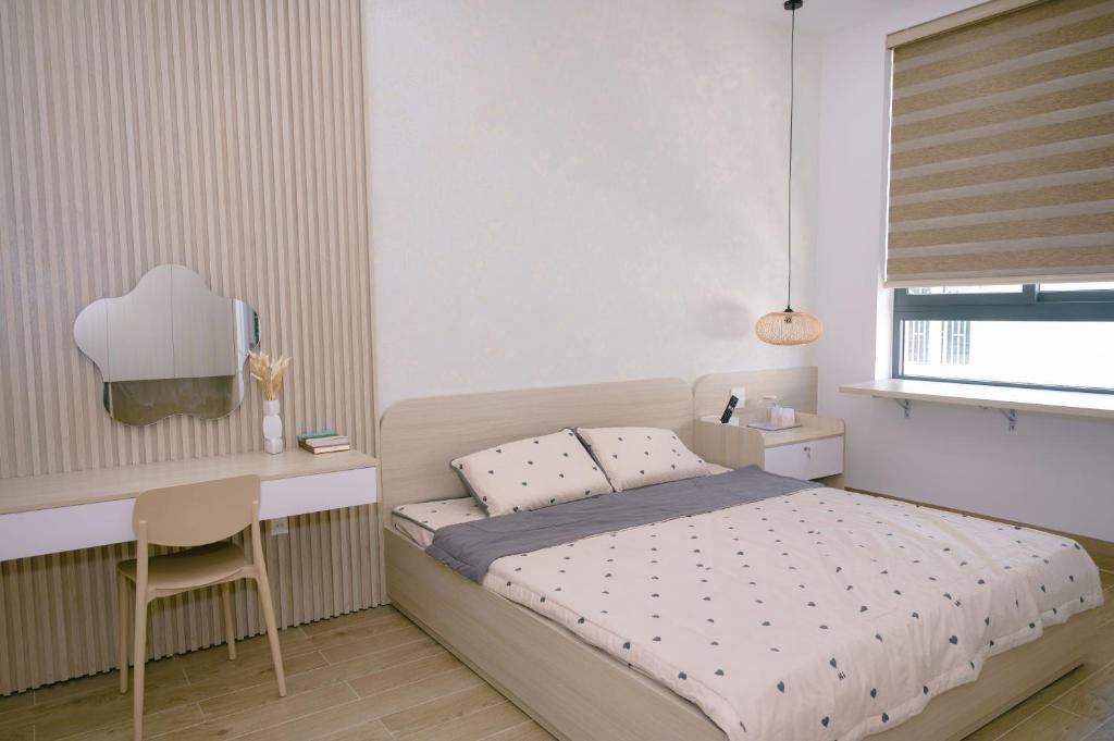 Postel nebo postele na pokoji v ubytování Sophia Healing House Cần Thơ