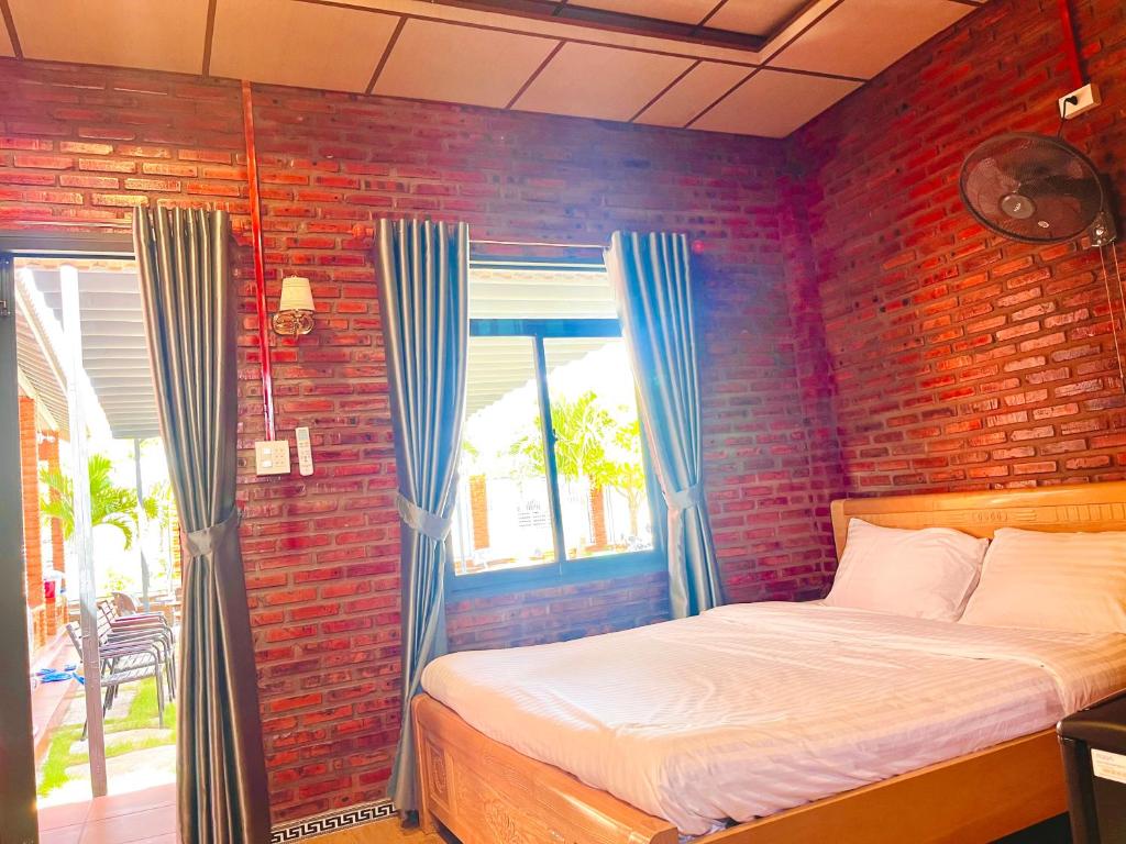 Postel nebo postele na pokoji v ubytování Bình Minh Homestay - Dốc Lết