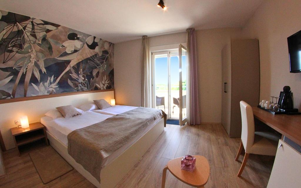 Postel nebo postele na pokoji v ubytování Villa Badi
