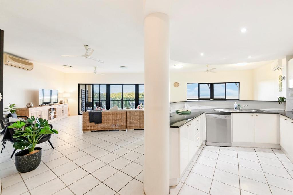 A kitchen or kitchenette at Oceanview Tropical - A Top End Poolside Oasis