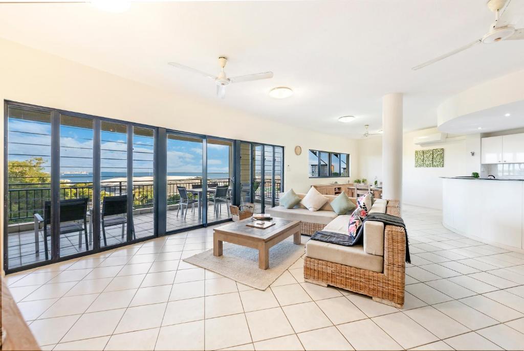 A seating area at Oceanview Tropical - A Top End Poolside Oasis