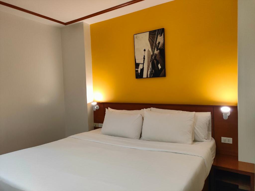 Postel nebo postele na pokoji v ubytování LaVie Hotel