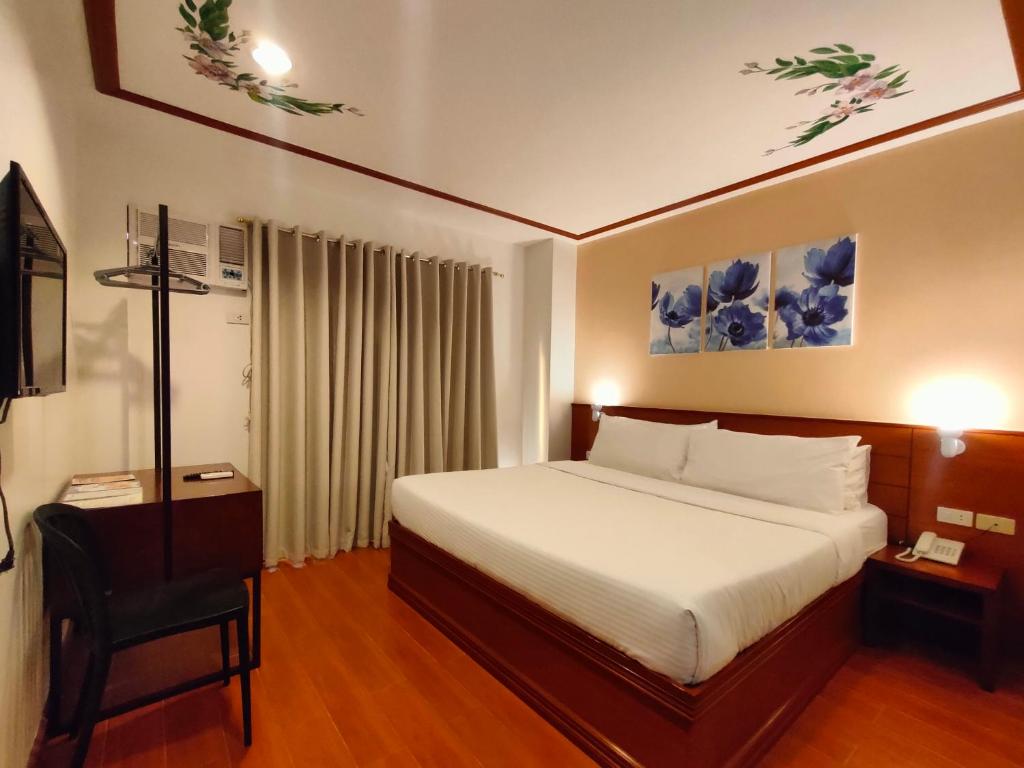 Postel nebo postele na pokoji v ubytování LaVie Hotel