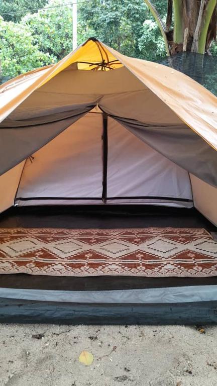 a tent is set up on the ground at Redang Campstay in Redang Island