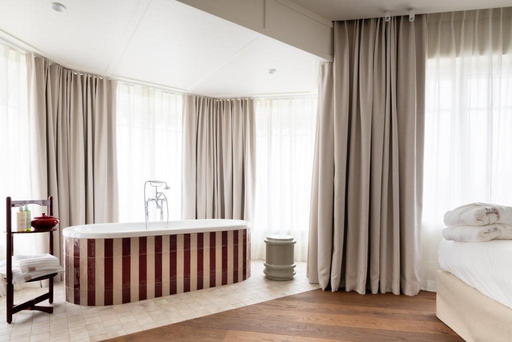 Postel nebo postele na pokoji v ubytování Hotel Villa Bonnie