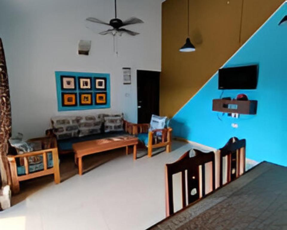 TV a/nebo společenská místnost v ubytování Ronne's 2BHK Lagoon Apartment -Calangute